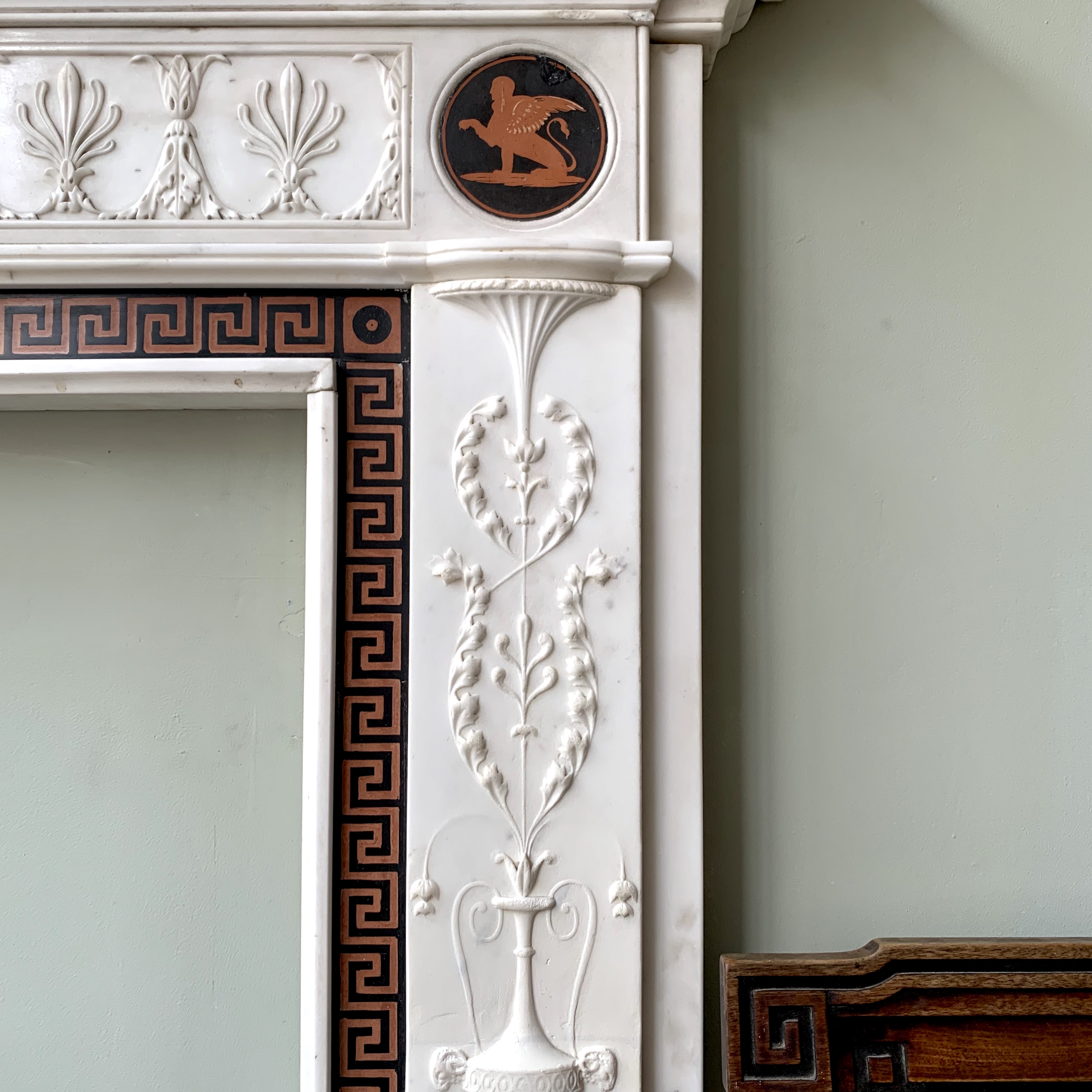 One of many antique chimneypieces in our collection and antique chairs..