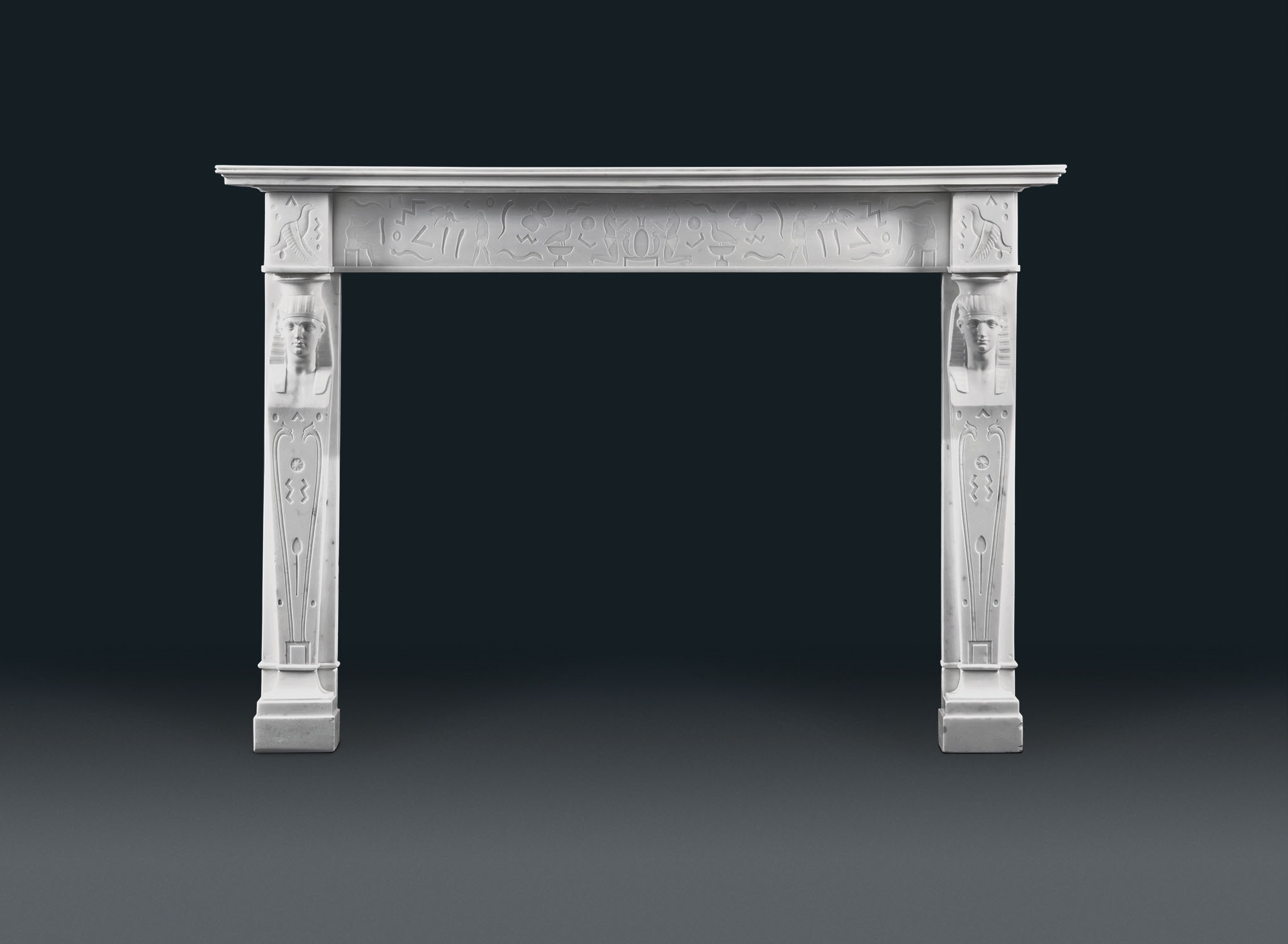 Antique Mantel N298: A magnificent, rare, English Regency, Neoclassical, Egyptian style, with running hieroglyphic carvings, supporting tapering caryatid jambs on footblocks.