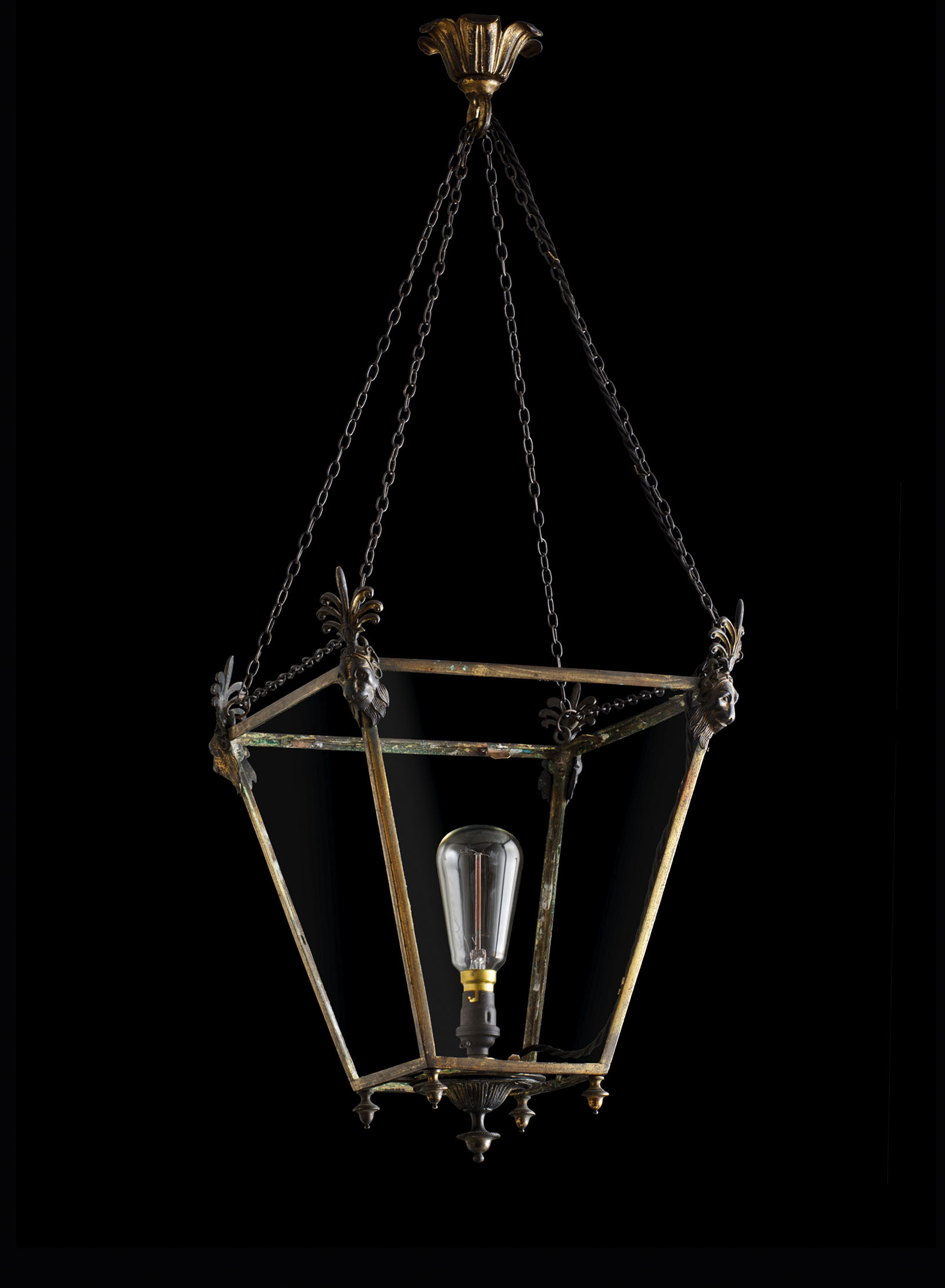 The Tatham Hanging Lantern is surmounted by female Egyptian lions masks capped with anthemion fronds.