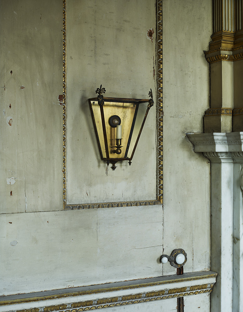 The Tatham Wall Lantern is surmounted by female Egyptian lions masks capped with anthemion fronds.